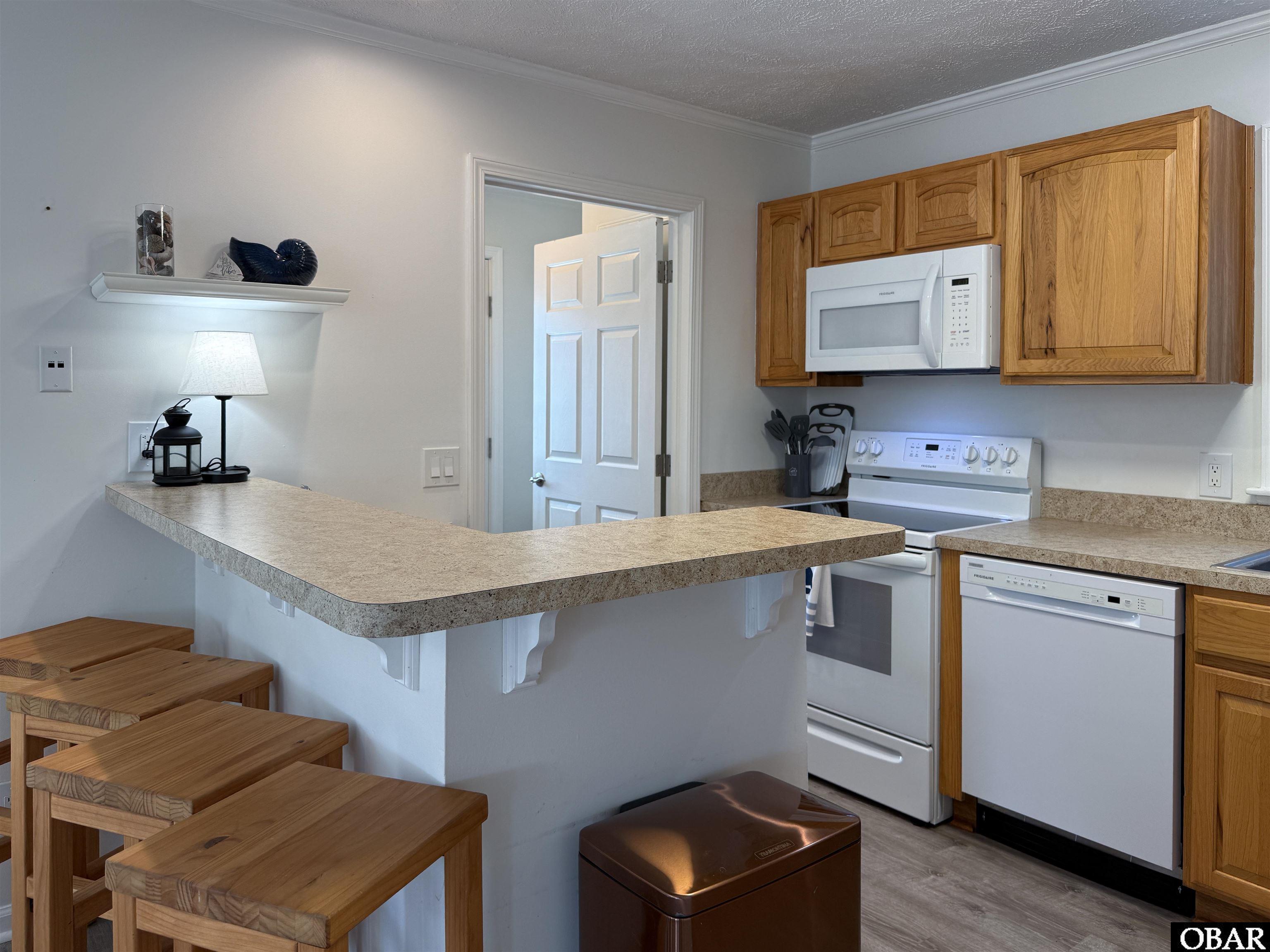 2230 Teal Road Corolla, NC 27927 - Photo 27 of 48 L2 kitchen and bar