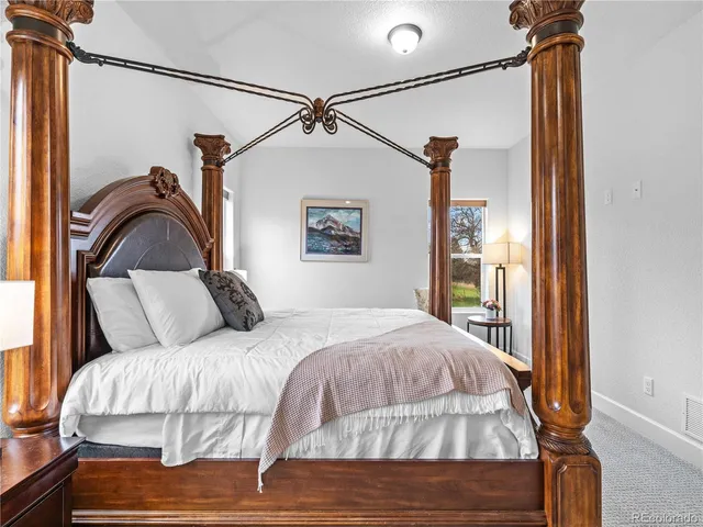 a bedroom with a bed and a mirror