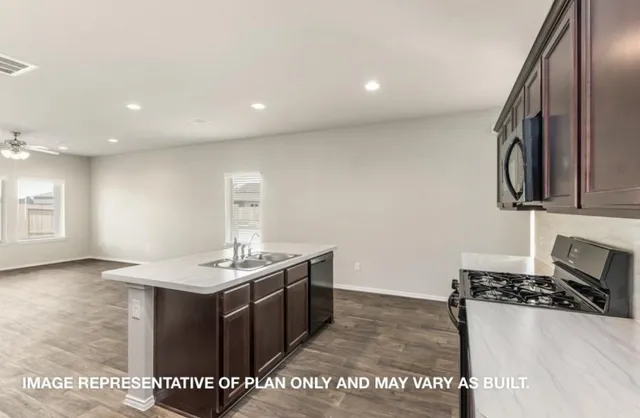 a kitchen with a sink and cabinets