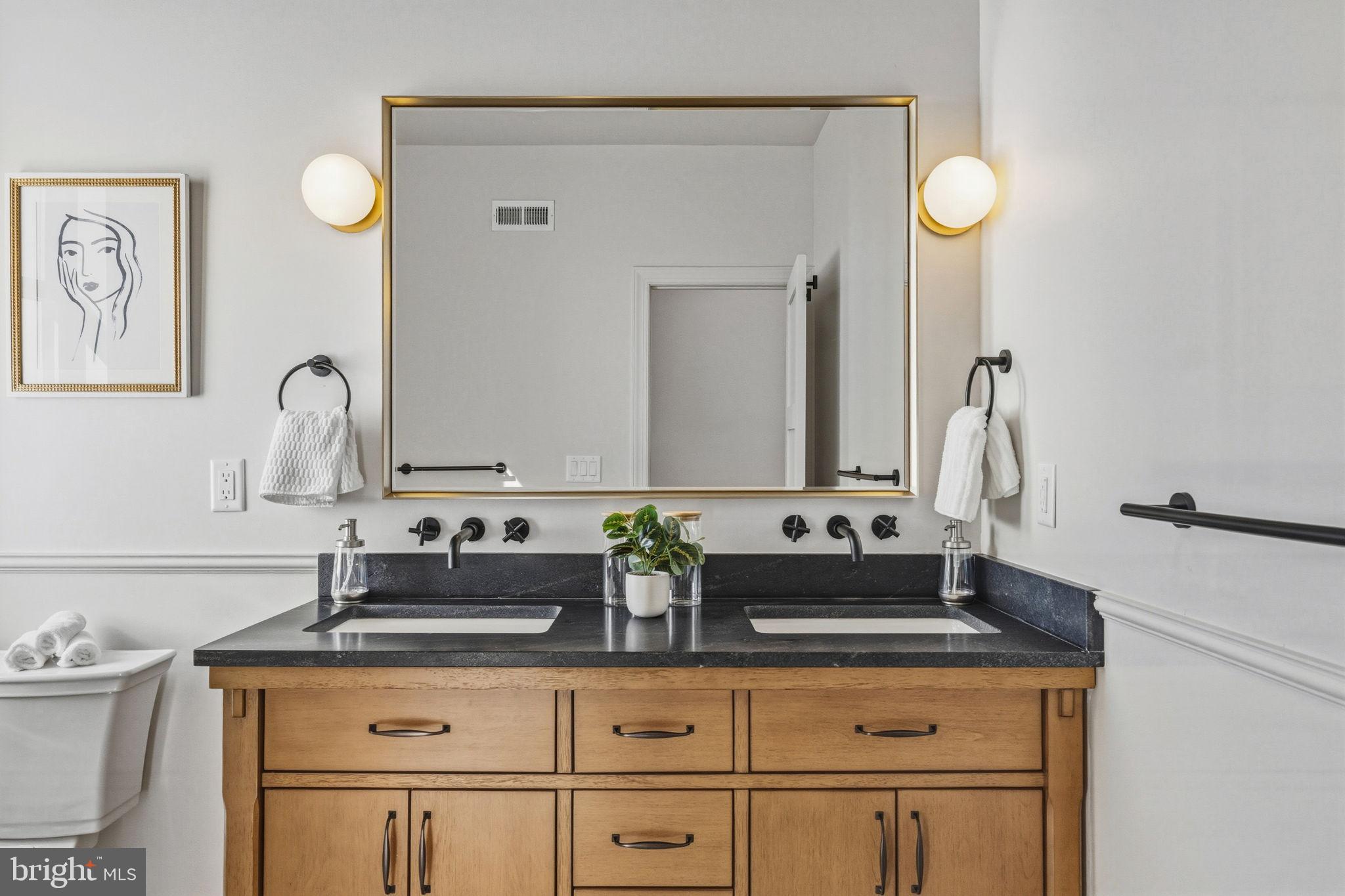1635 South 5th Street Philadelphia, PA 19148 - Photo 44 of 60 Elegant dual-sink bathroom with modern touches.