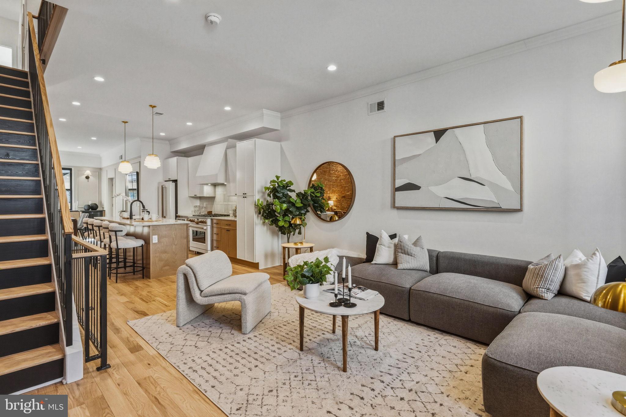 1635 South 5th Street Philadelphia, PA 19148 - Photo 8 of 60 a living room with furniture and a rug