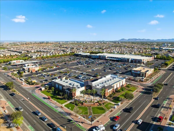 an aerial view of a city with lounge chairs