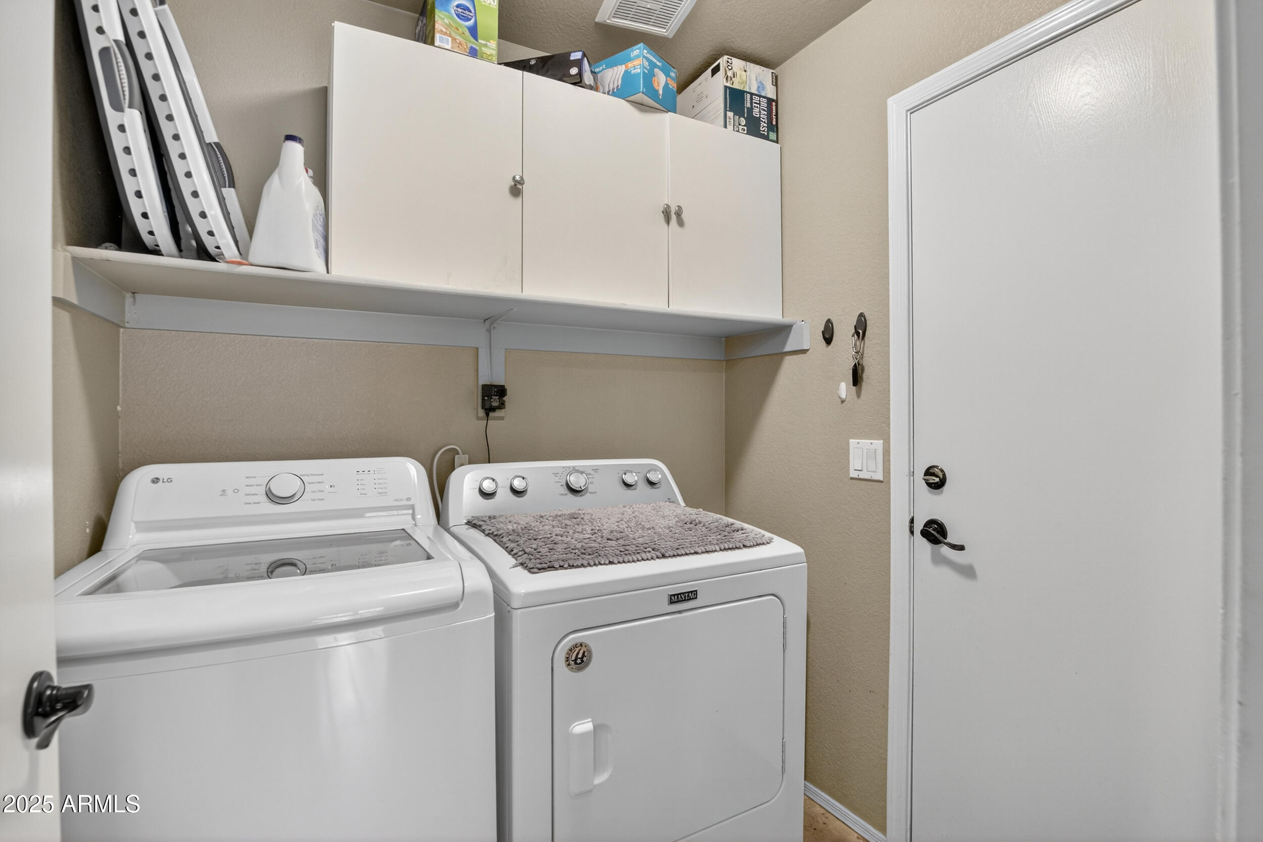 3930 East Agave Road Phoenix, AZ 85044 - Photo 35 of 44 a utility room with dryer and washer