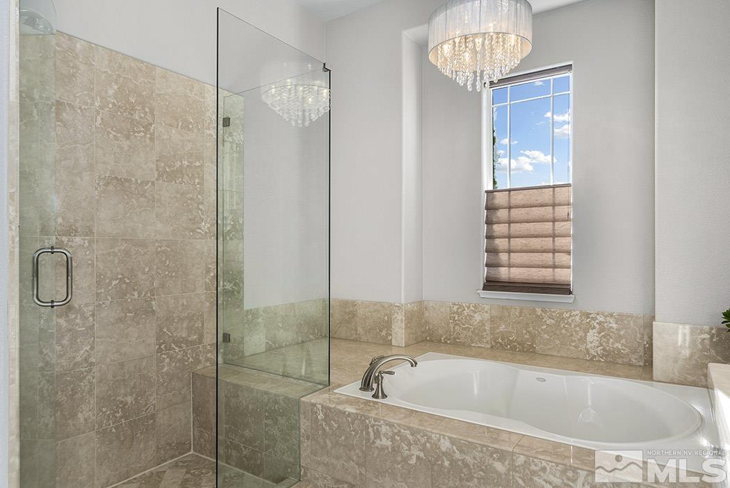 2200 South Tesuque Road Reno, NV 89511 - Photo 17 of 28 a bath tub sitting next to a window