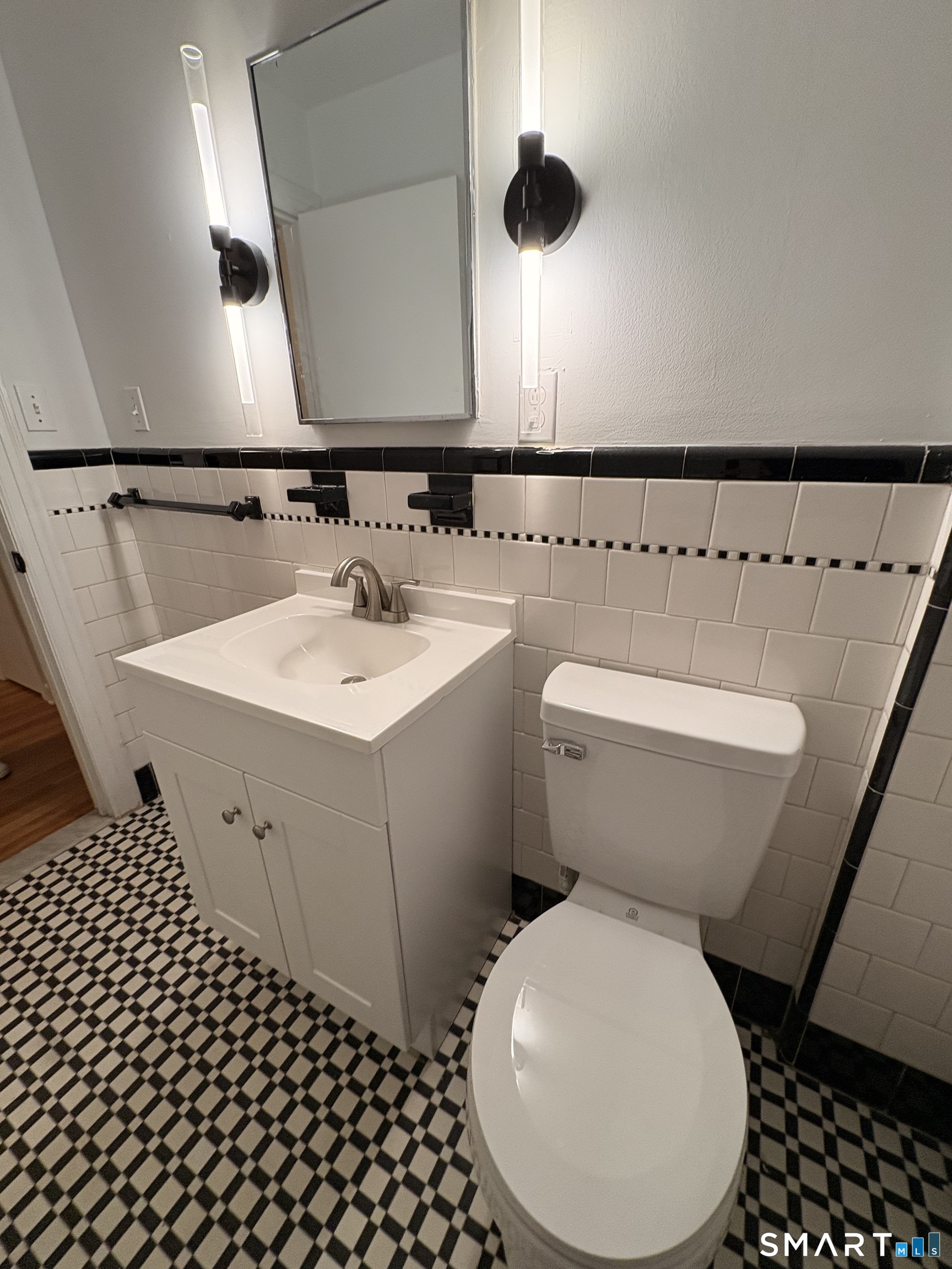 7 Rourke Avenue Southington, CT 06489 - Photo 5 of 7 a bathroom with a sink and a mirror