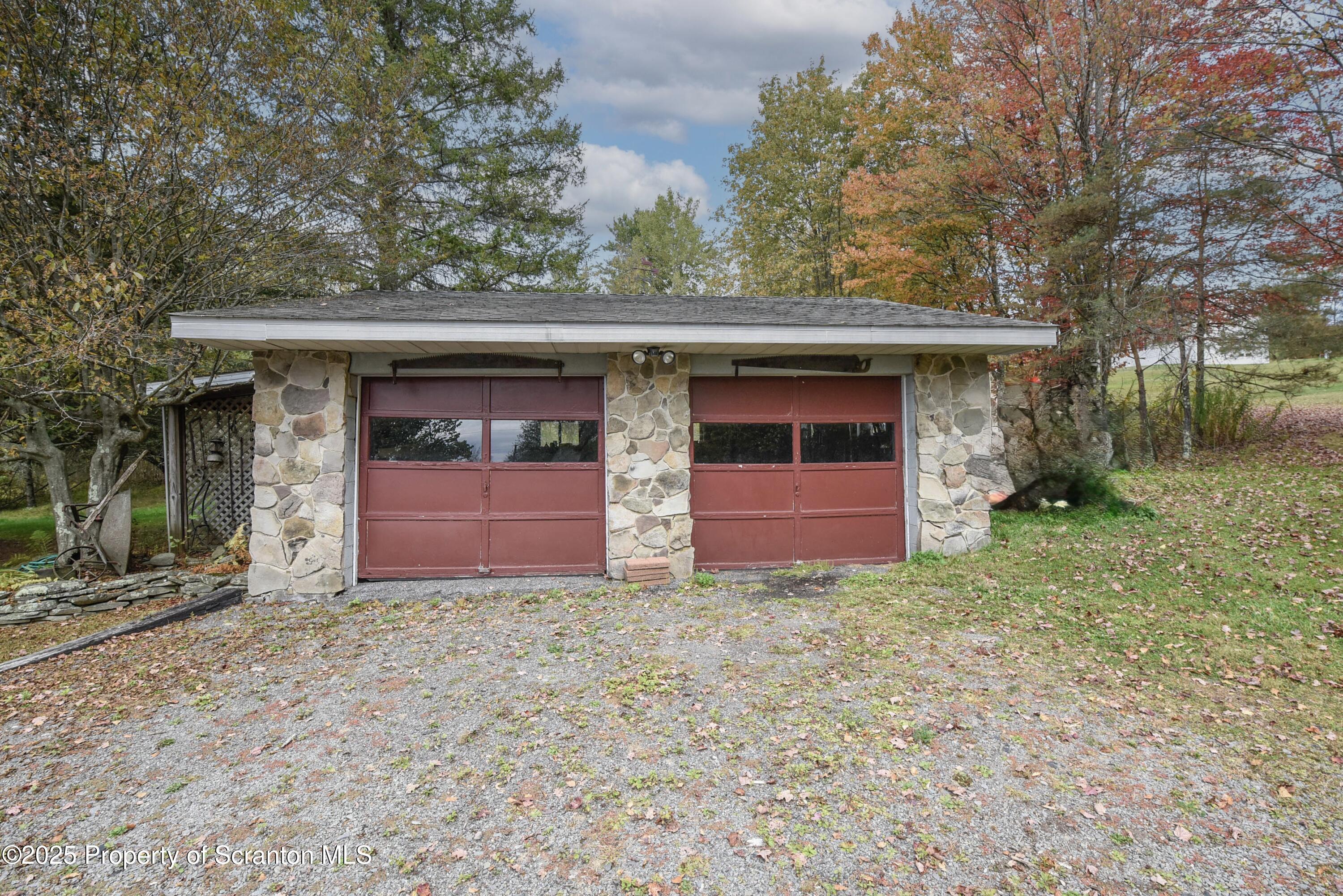 2011 Aberdeen Road, Unit OFF ABERDEEN R Moscow, PA 18444 - Photo 54 of 74 a front view of a house with yard