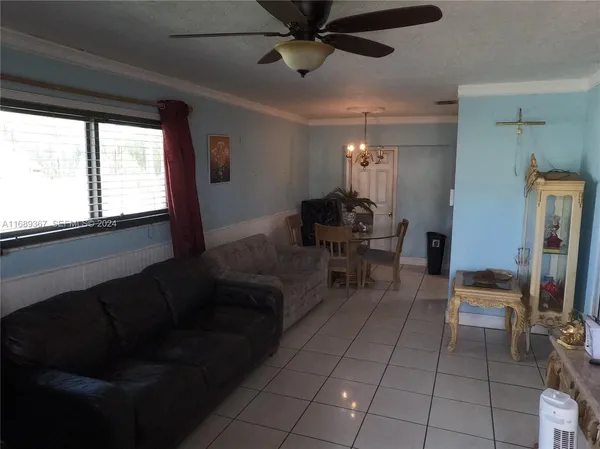 a living room with furniture and a window