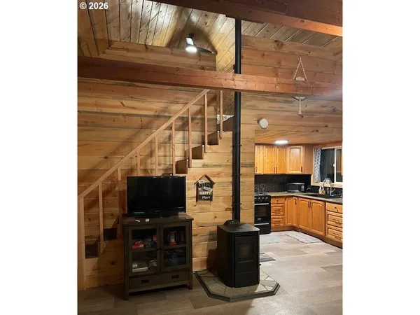 a kitchen with a sink and a stove top oven