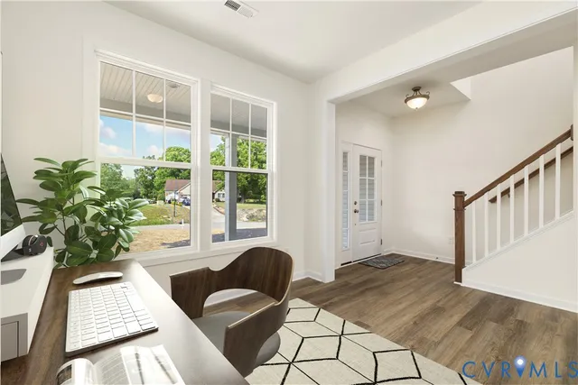 a kitchen with a table chairs stove and cabinets