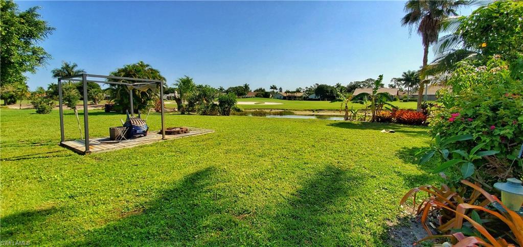 391 Torrey Pines Point Naples, FL 34113 - Photo 32 of 32 a view of a park with swings and slides