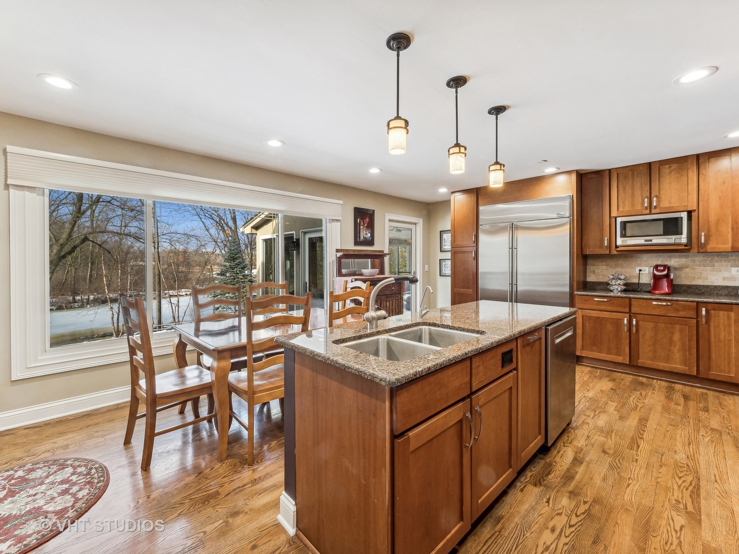 3143 Cuba Road Long Grove, IL 60047 - Photo 13 of 40 a kitchen with stainless steel appliances granite countertop a stove and a wooden floors