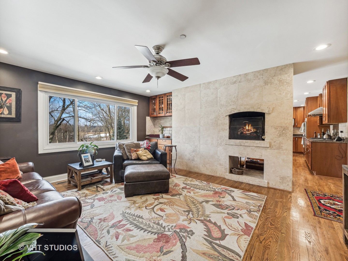 3143 Cuba Road Long Grove, IL 60047 - Photo 17 of 40 a living room with furniture flat screen tv and a fireplace