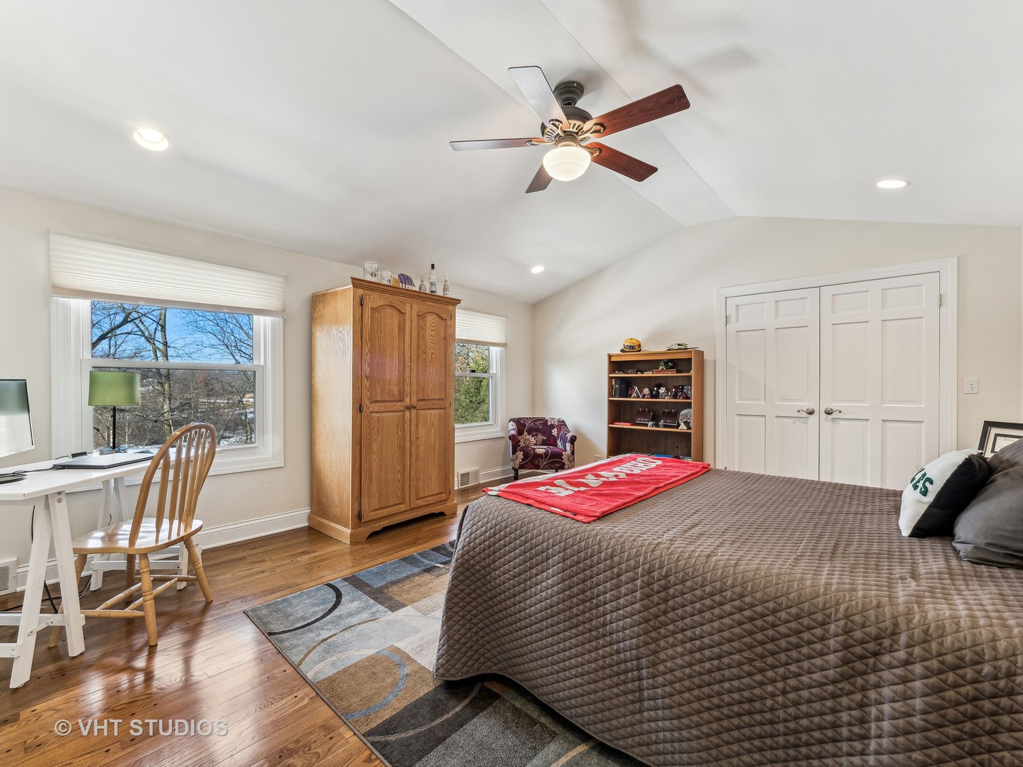 3143 Cuba Road Long Grove, IL 60047 - Photo 26 of 40 a bedroom with a bed and a chandelier