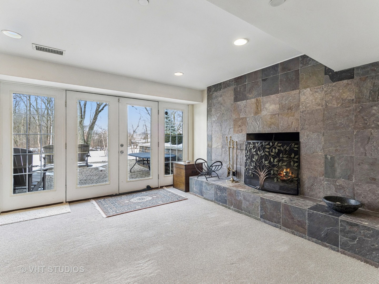 3143 Cuba Road Long Grove, IL 60047 - Photo 35 of 40 a living room with furniture a fireplace and a floor to ceiling window