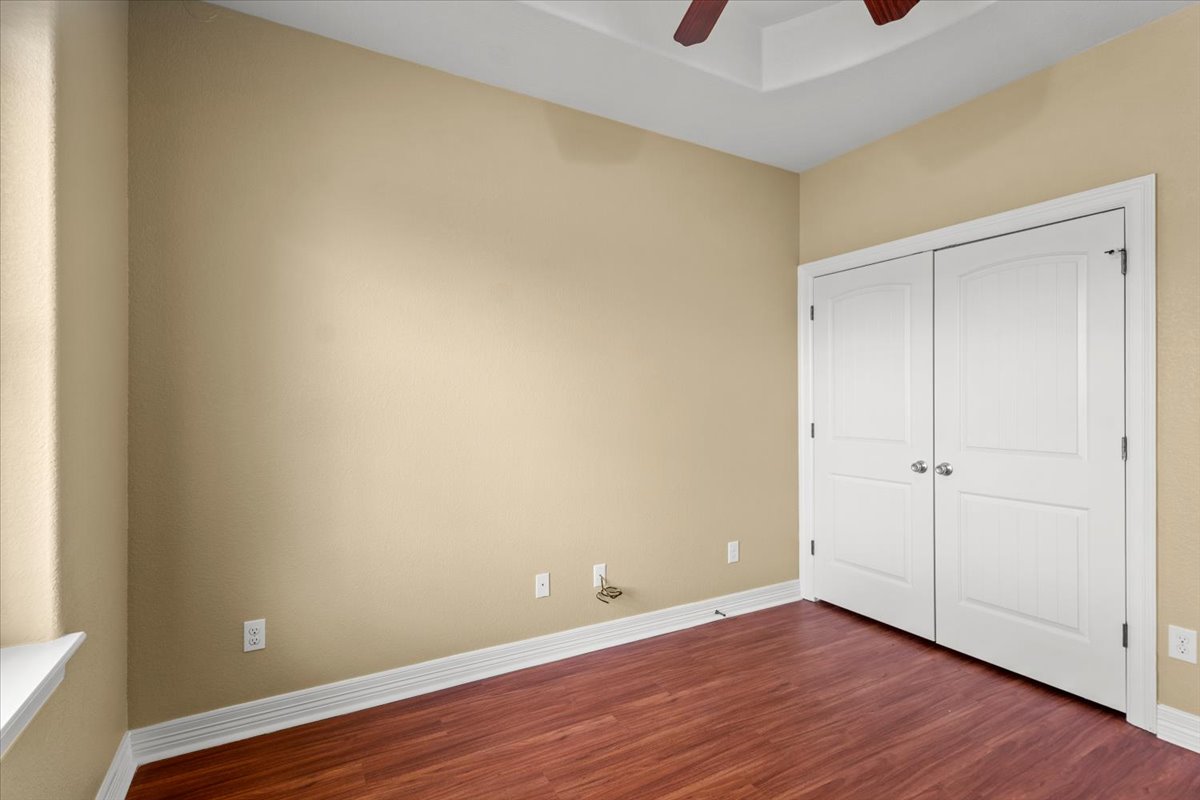 437 Balch Road Elgin, TX 78621 - Photo 21 of 37 Rich hardwood floors complement neutral walls in this versatile space.