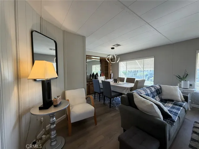 a living room with furniture and a lamp