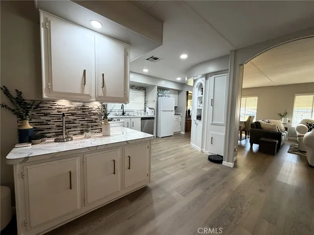 a kitchen with a sink stove and refrigerator