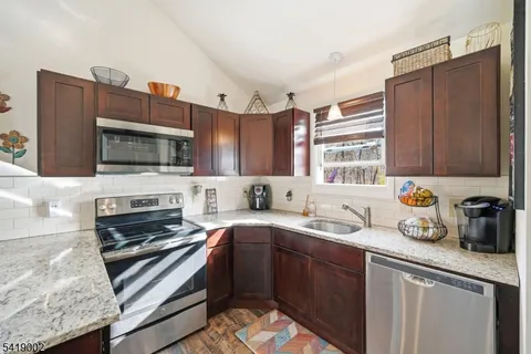 a view of a living room and kitchen