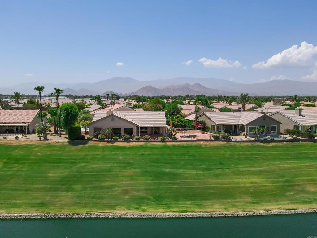 39303 Gleneagles Circle Palm Desert, CA 92211 - Photo 14 of 71 a aerial view of a house with a yard and outdoor seating
