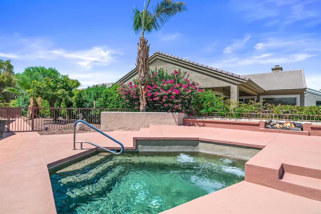 39303 Gleneagles Circle Palm Desert, CA 92211 - Photo 22 of 71 a view of a backyard with a garden and plants