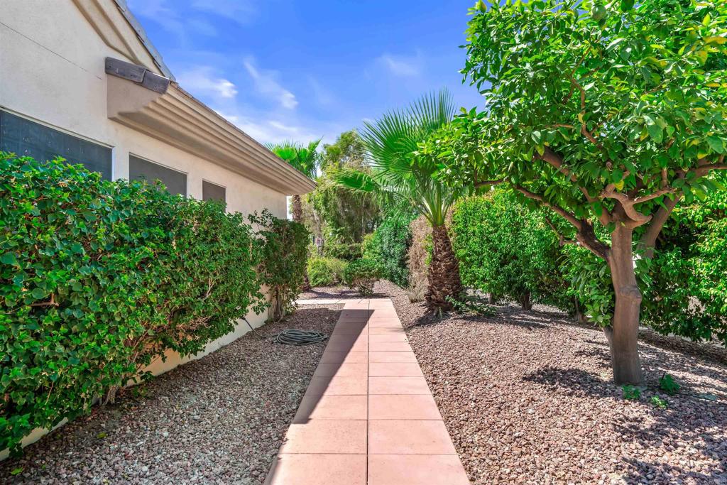 39303 Gleneagles Circle Palm Desert, CA 92211 - Photo 23 of 71 a view of a pathway with a house