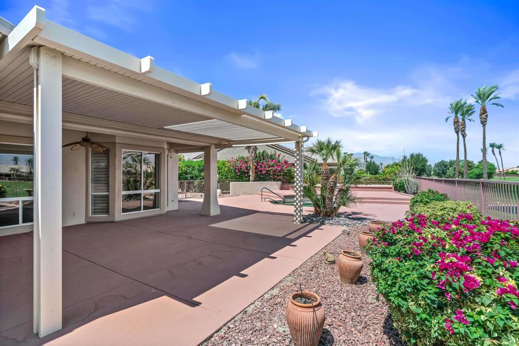 39303 Gleneagles Circle Palm Desert, CA 92211 - Photo 33 of 71 a view of a backyard with garden and patio