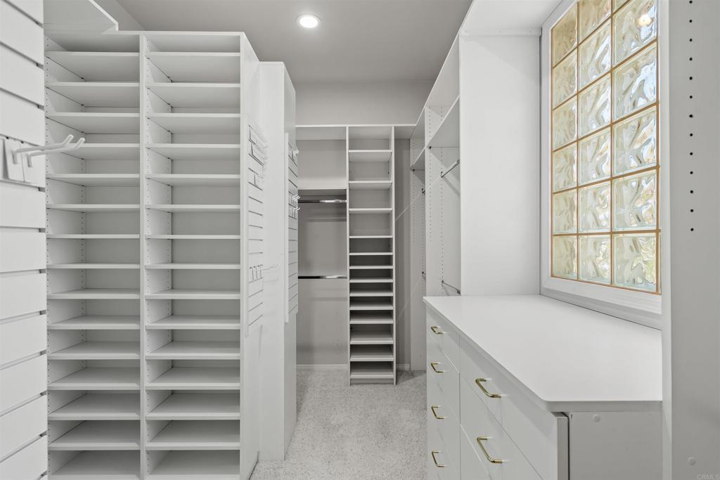 39303 Gleneagles Circle Palm Desert, CA 92211 - Photo 43 of 71 a view of walk in closet with empty racks