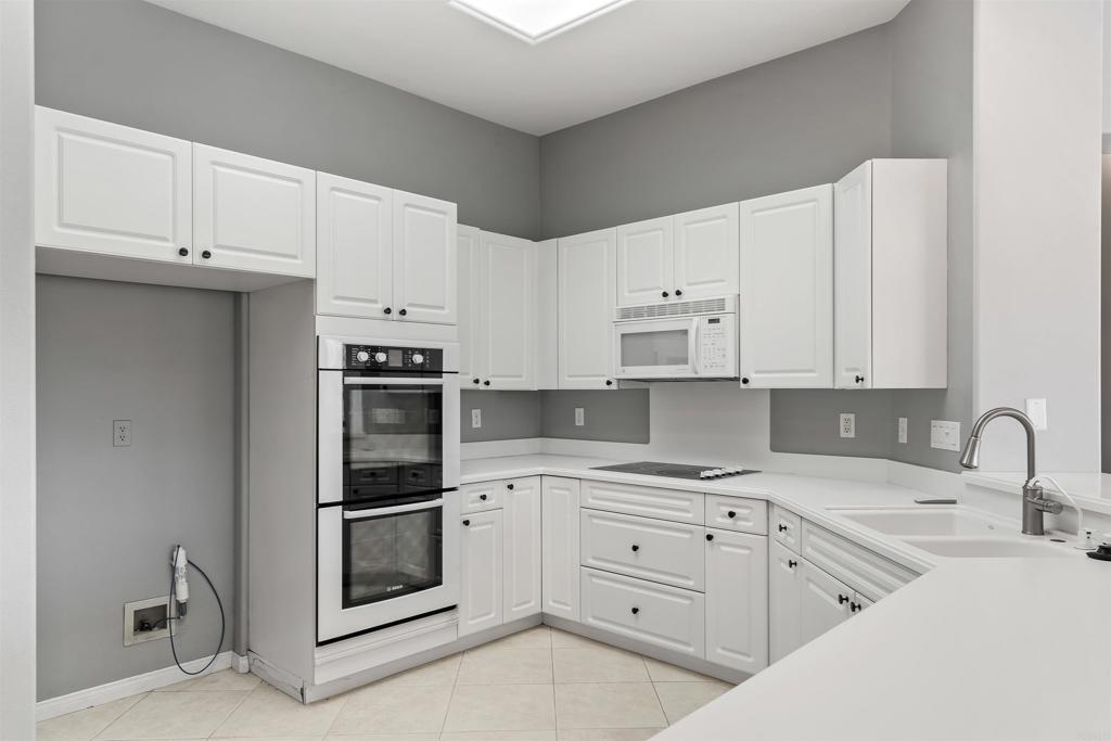 39303 Gleneagles Circle Palm Desert, CA 92211 - Photo 47 of 71 a kitchen with cabinets stainless steel appliances and sink