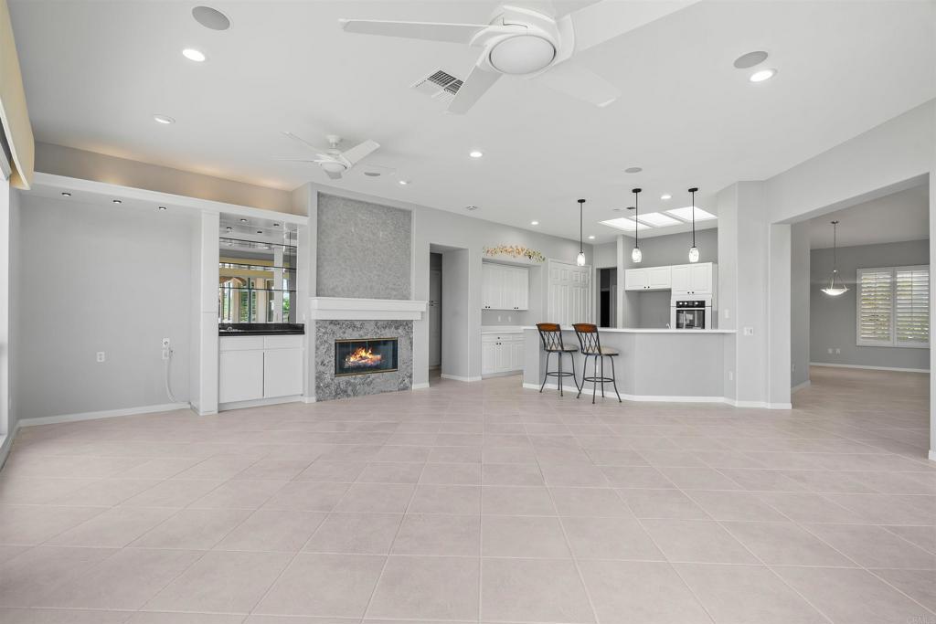 39303 Gleneagles Circle Palm Desert, CA 92211 - Photo 58 of 71 an empty room with furniture and a fireplace