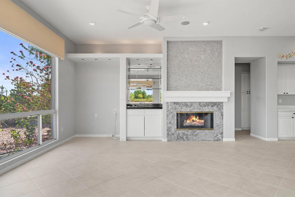 39303 Gleneagles Circle Palm Desert, CA 92211 - Photo 59 of 71 an empty room with windows and fireplace
