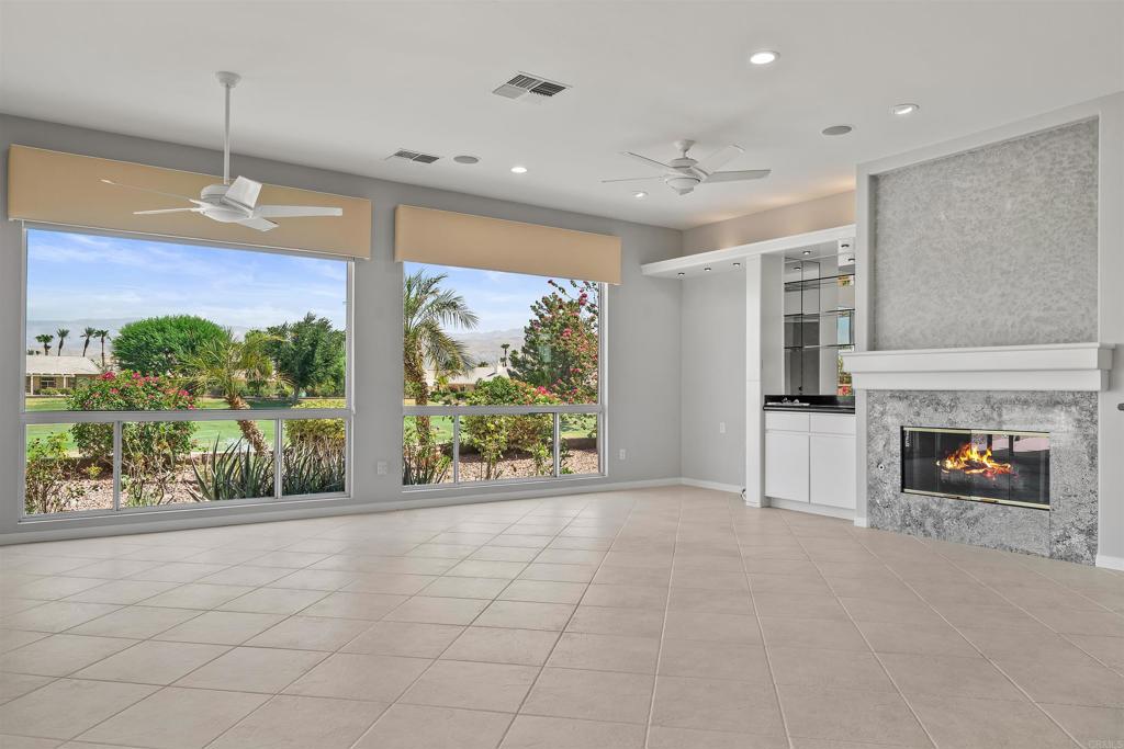 39303 Gleneagles Circle Palm Desert, CA 92211 - Photo 66 of 71 a view of an empty room with a fireplace and a window
