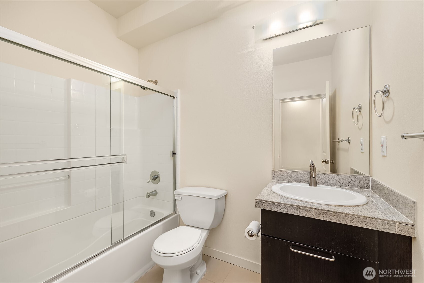 1900 17th Avenue Northeast Issaquah, WA 98029 - Photo 15 of 22 a bathroom with a granite countertop sink toilet and shower