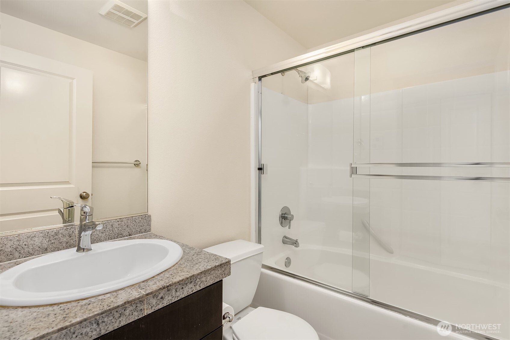 1900 17th Avenue Northeast Issaquah, WA 98029 - Photo 17 of 22 a bathroom with a granite countertop sink toilet and shower