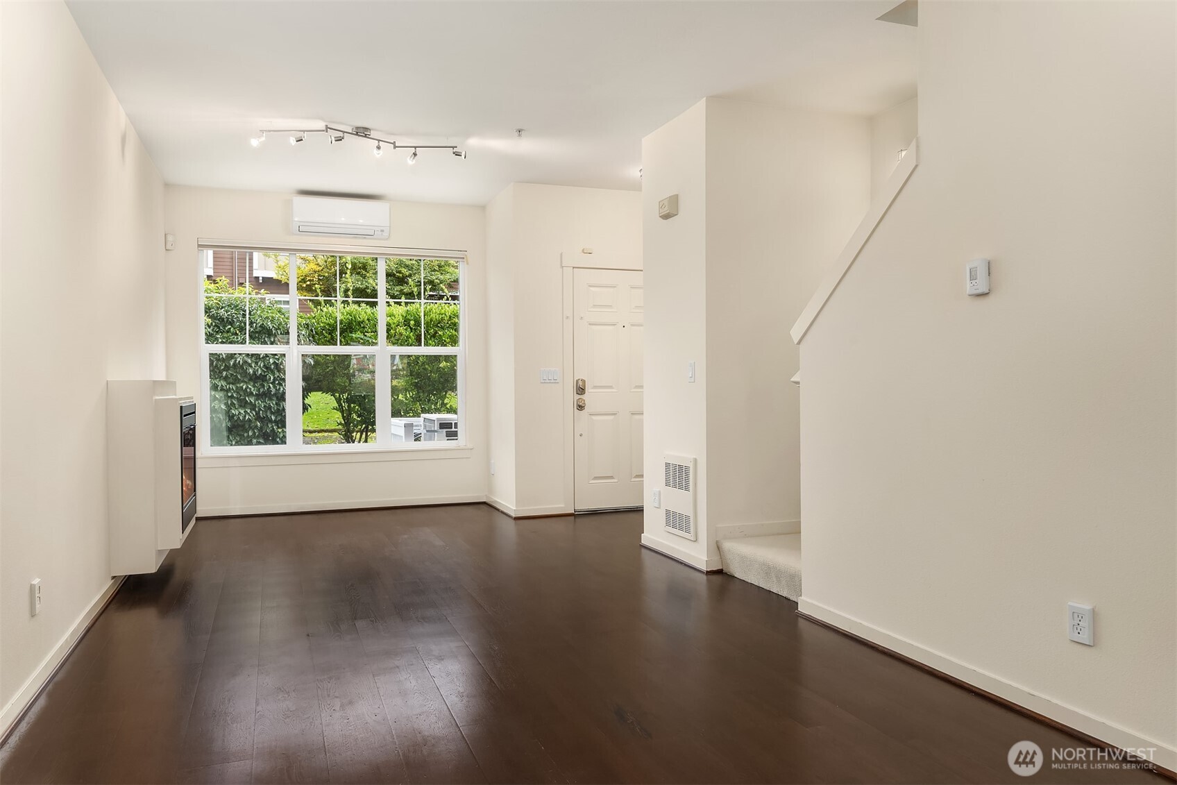 1900 17th Avenue Northeast Issaquah, WA 98029 - Photo 5 of 22 an empty room with wooden floor and windows