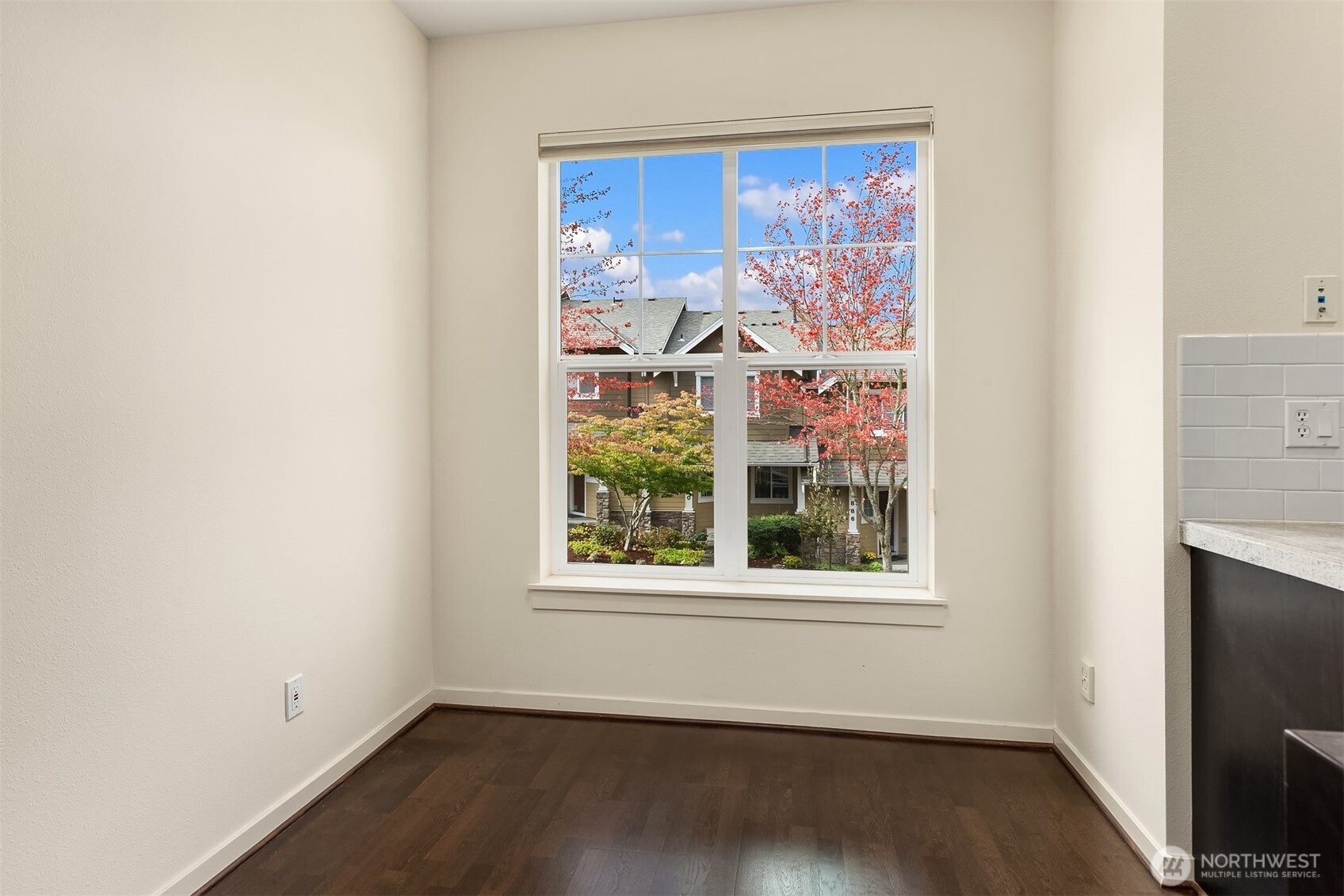 1900 17th Avenue Northeast Issaquah, WA 98029 - Photo 6 of 22 an empty room with wooden floor and windows