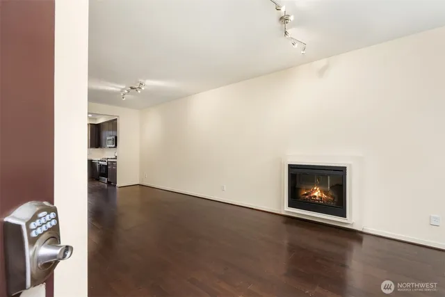 a view of an empty room and fire place