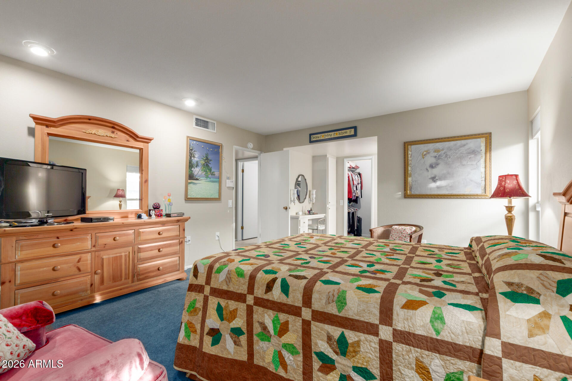 9705 West Oak Ridge Drive Sun City, AZ 85351 - Photo 12 of 23 a bedroom with a bed and a flat screen tv