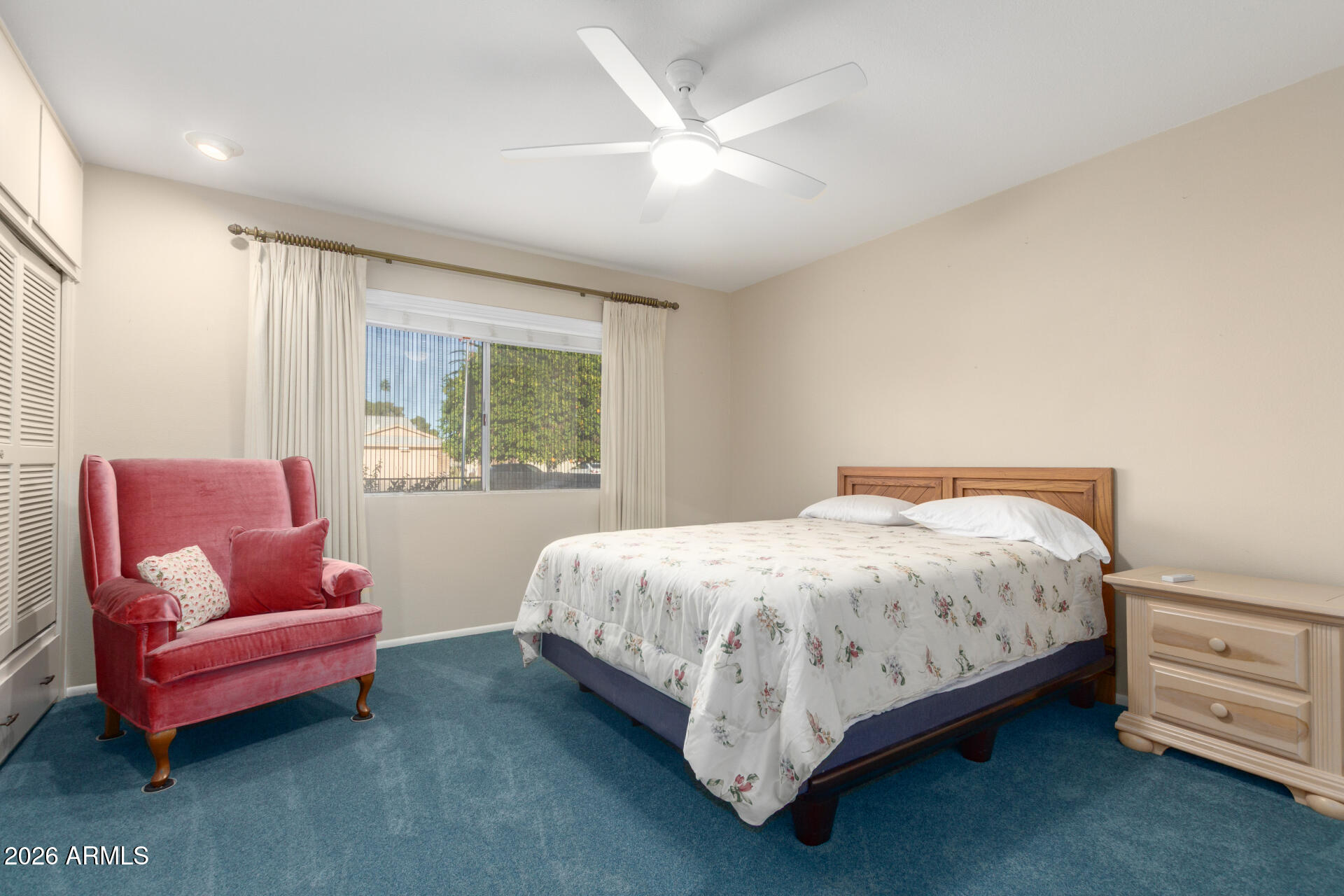 9705 West Oak Ridge Drive Sun City, AZ 85351 - Photo 16 of 23 a bed room with a bed and a couch