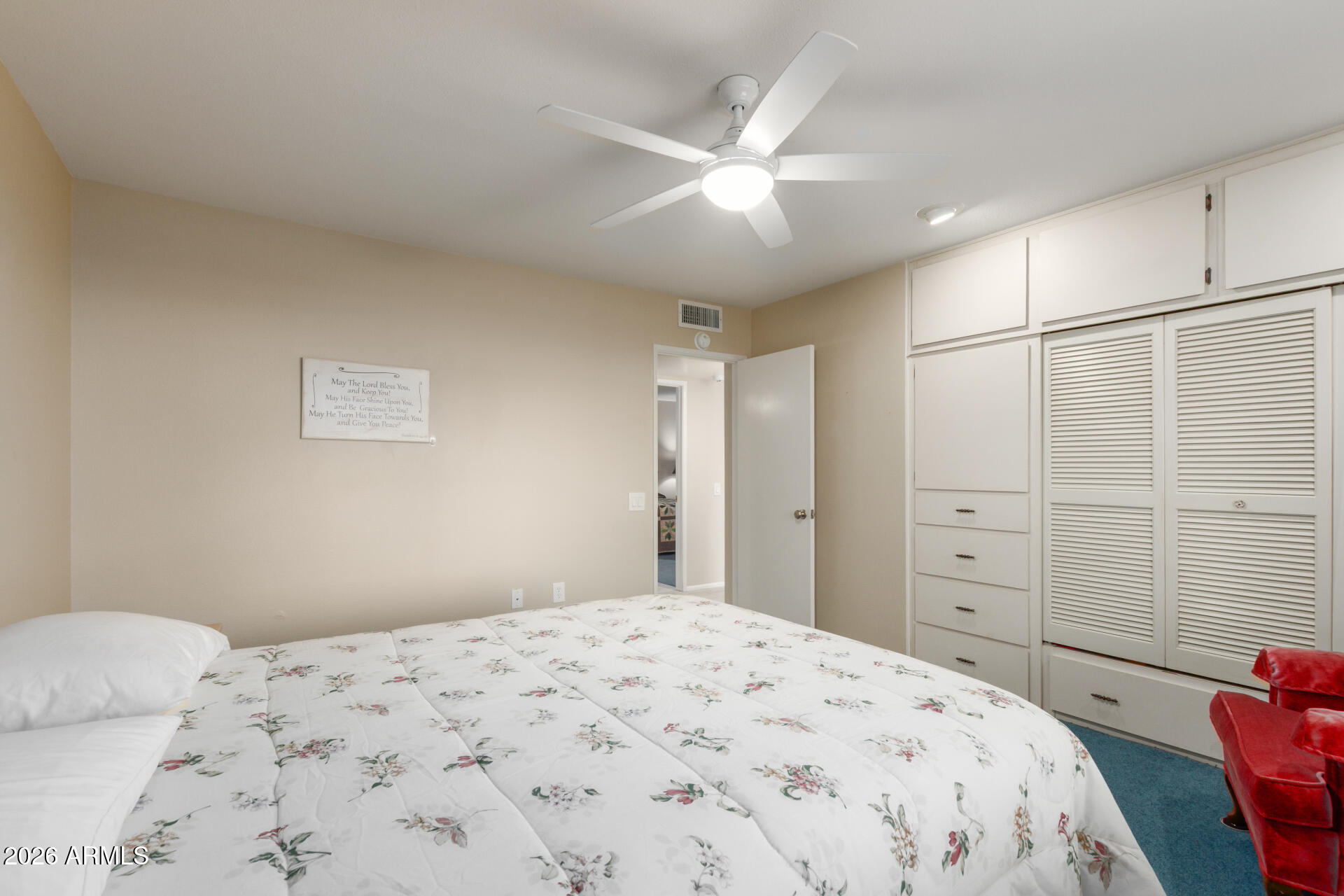 9705 West Oak Ridge Drive Sun City, AZ 85351 - Photo 17 of 23 a bedroom with a bed and a window
