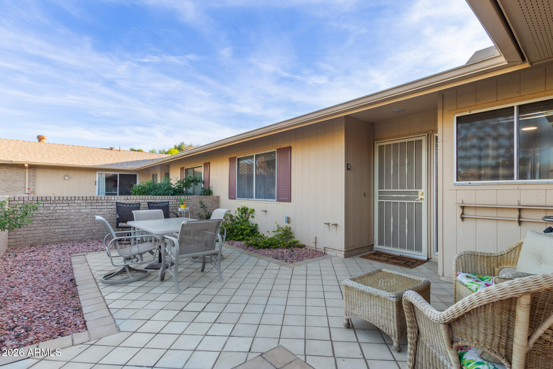 9705 West Oak Ridge Drive Sun City, AZ 85351 - Photo 2 of 23 a view of house with patio outdoor seating