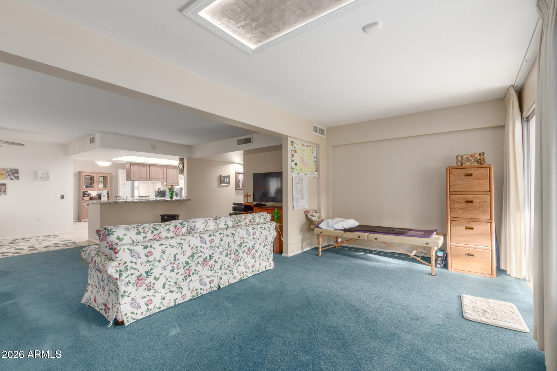 9705 West Oak Ridge Drive Sun City, AZ 85351 - Photo 8 of 23 a bed room with furniture and a window