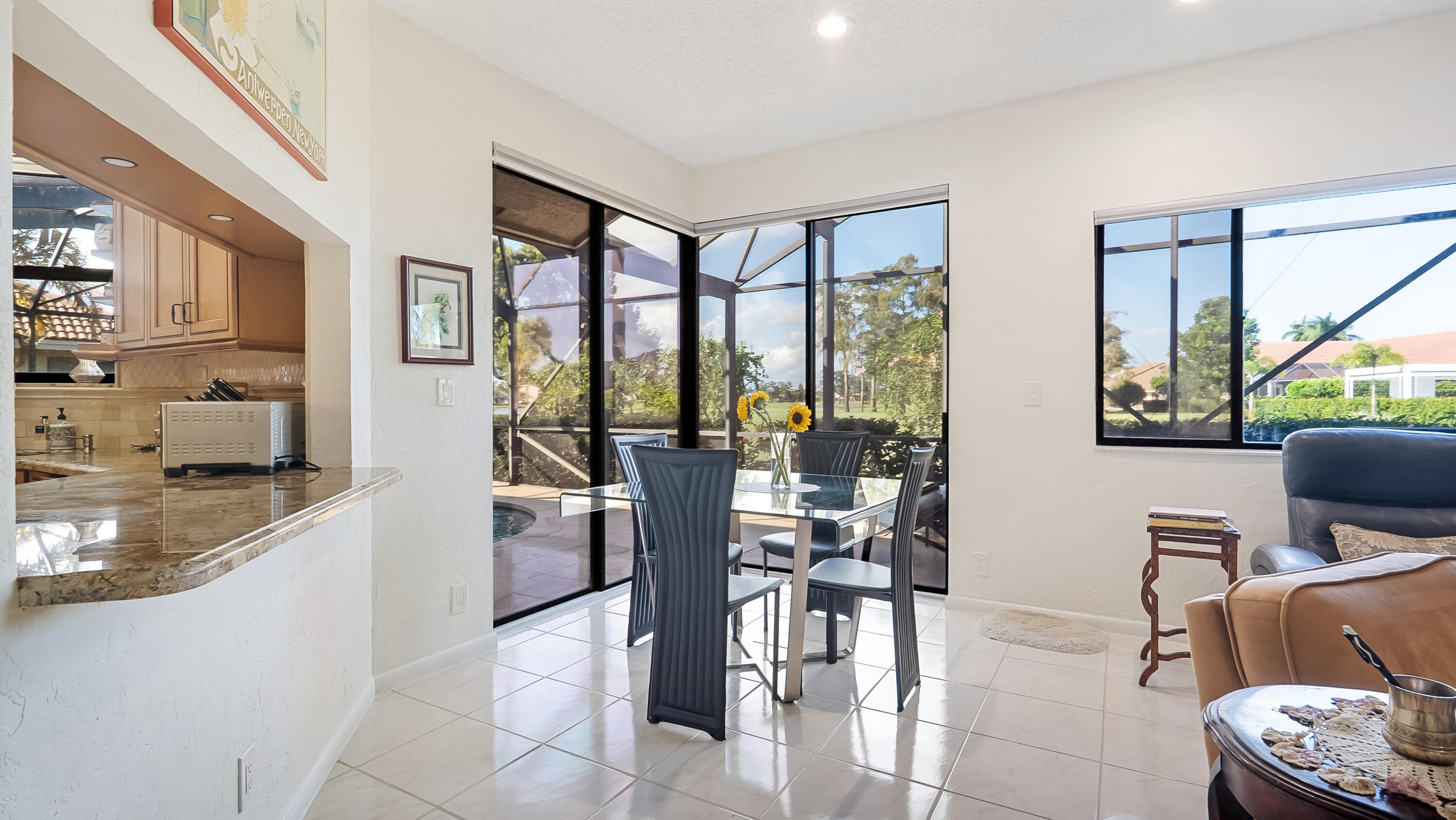 10767 Boca Woods Lane Boca Raton, FL 33428 - Photo 22 of 64 a view of a dining room with furniture window and outside view