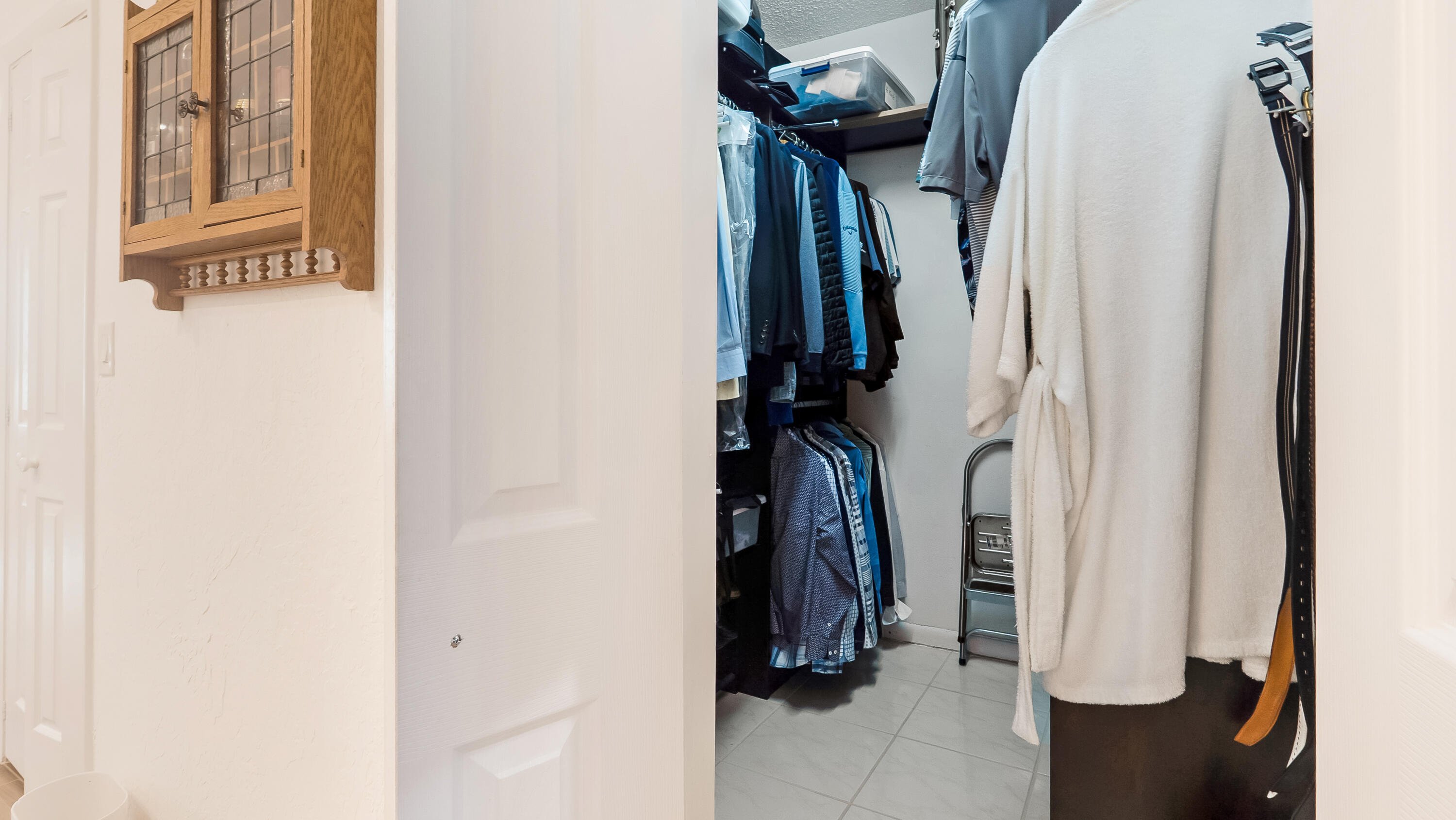 10767 Boca Woods Lane Boca Raton, FL 33428 - Photo 31 of 64 a view of walk in closet with clothes and shoes