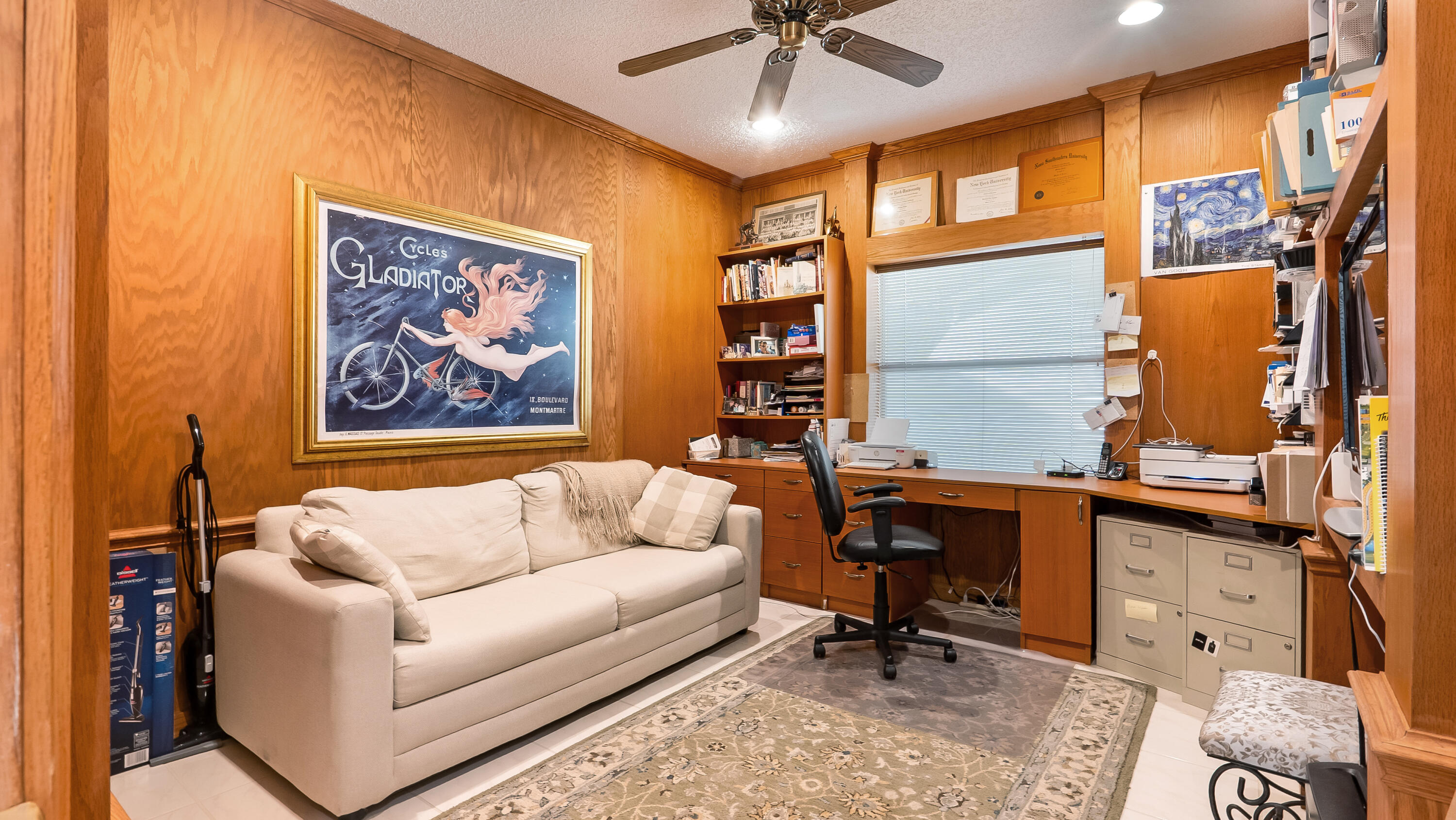 10767 Boca Woods Lane Boca Raton, FL 33428 - Photo 36 of 64 a living room with furniture a ceiling fan and a window