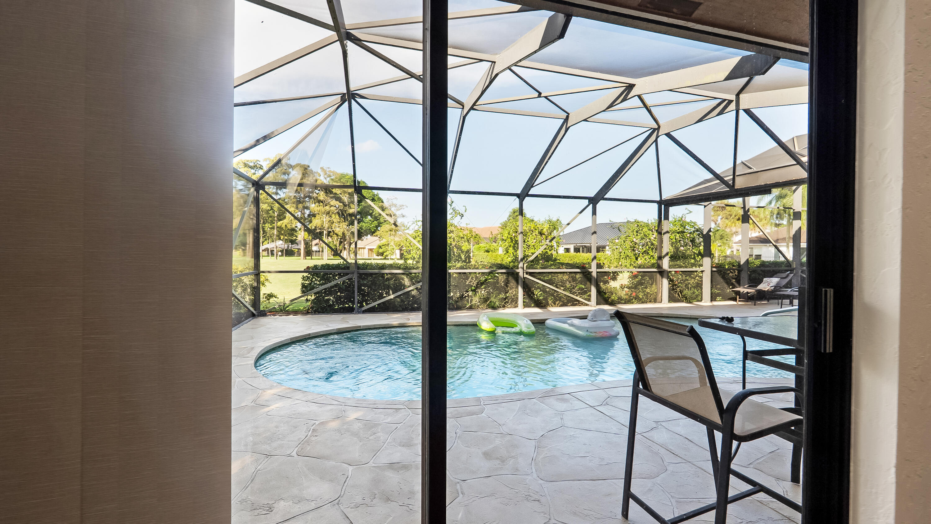 10767 Boca Woods Lane Boca Raton, FL 33428 - Photo 46 of 64 a view of an outdoor space with a table and chairs