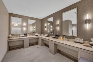10767 Boca Woods Lane Boca Raton, FL 33428 - Photo 56 of 64 a large bathroom with a double vanity sink and a mirror