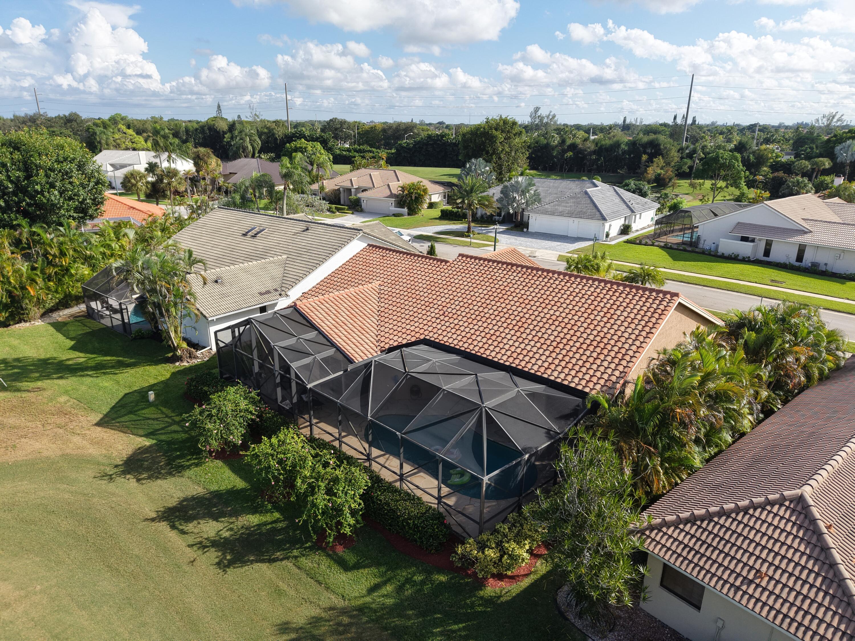 10767 Boca Woods Lane Boca Raton, FL 33428 - Photo 6 of 64 a view of a swimming pool and outdoor space