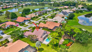 10767 Boca Woods Lane Boca Raton, FL 33428 - Photo 63 of 64 an aerial view of residential house with yard and outdoor seating