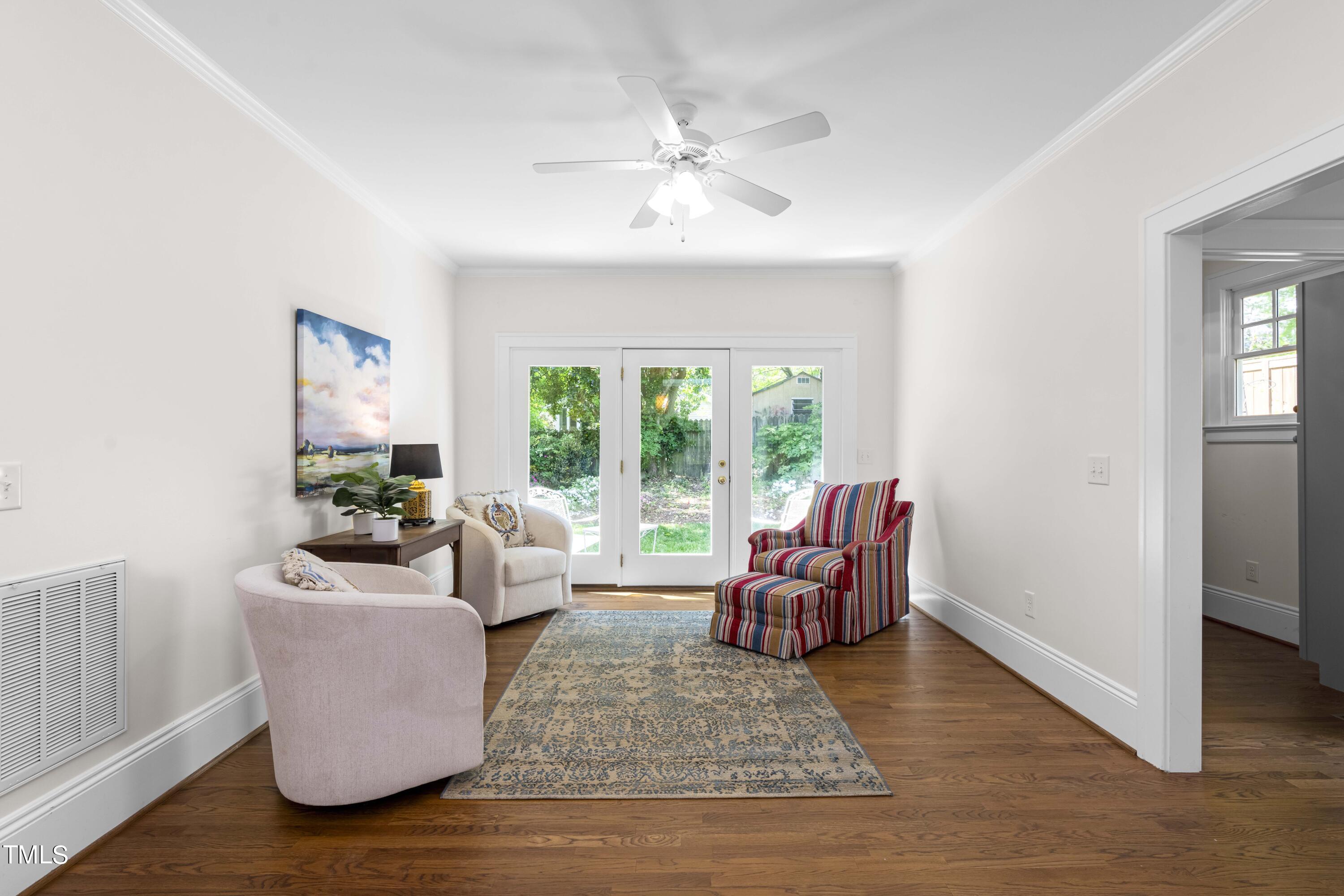 504 Holden Street Raleigh, NC 27604 - Photo 12 of 26 a living room with furniture and a large window