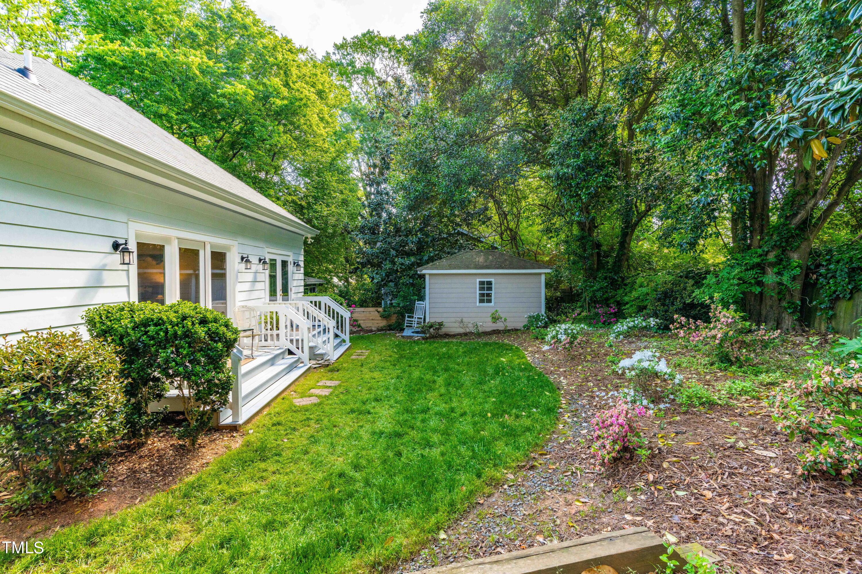 504 Holden Street Raleigh, NC 27604 - Photo 20 of 26 a house view with a garden space